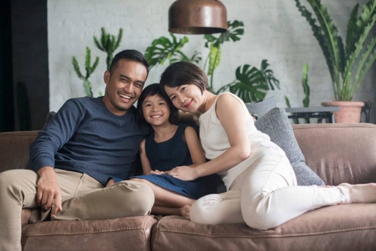 family of three in the living room