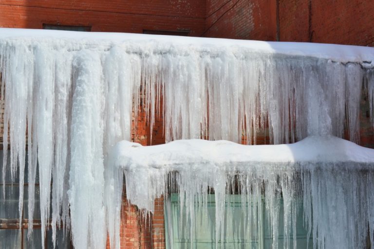 snow and ice on house exterior