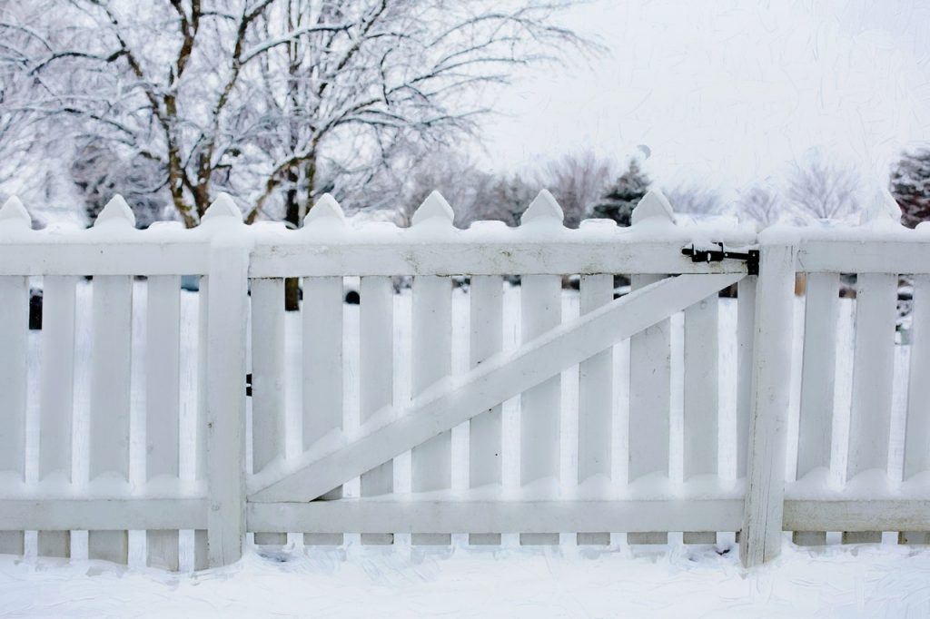 white picket fence snow