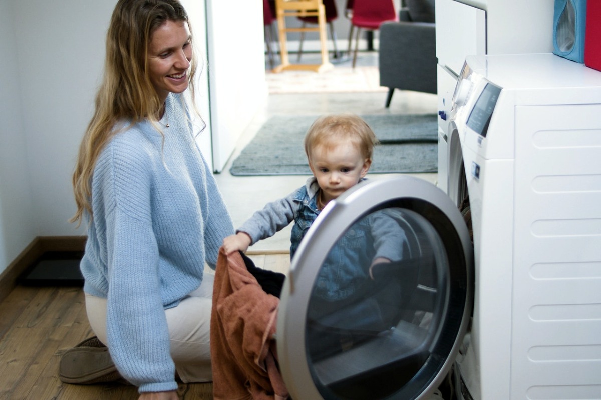 mother and child doing laundry