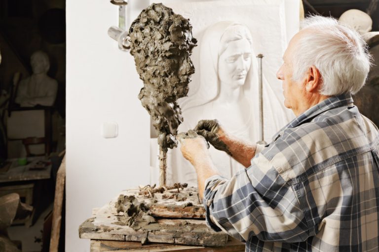 man sculpting customized figure
