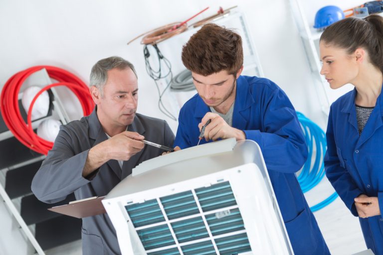 men doing equipment maintenance