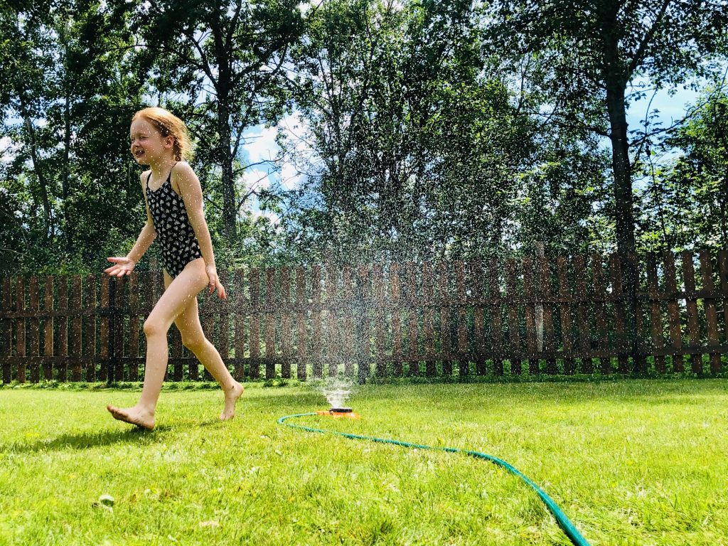 child playing on backyard