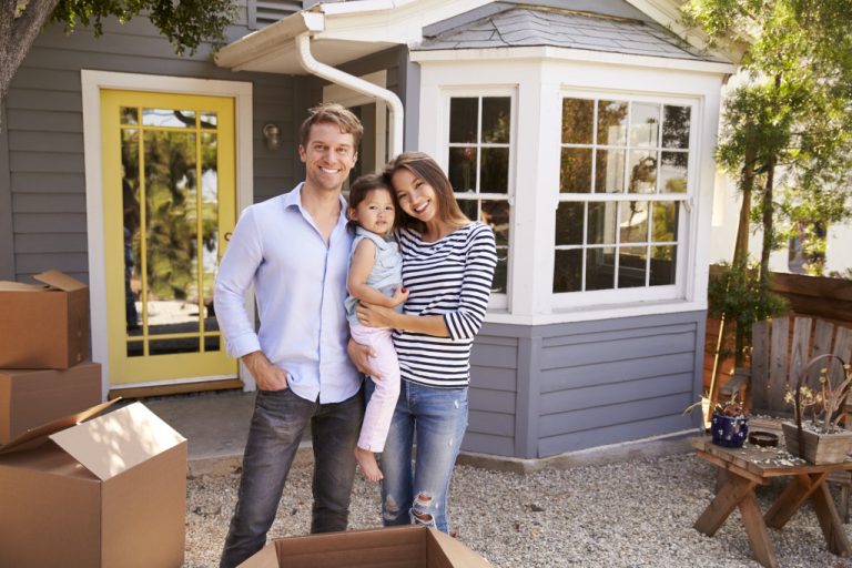 A photo of a family who just moved to their new home