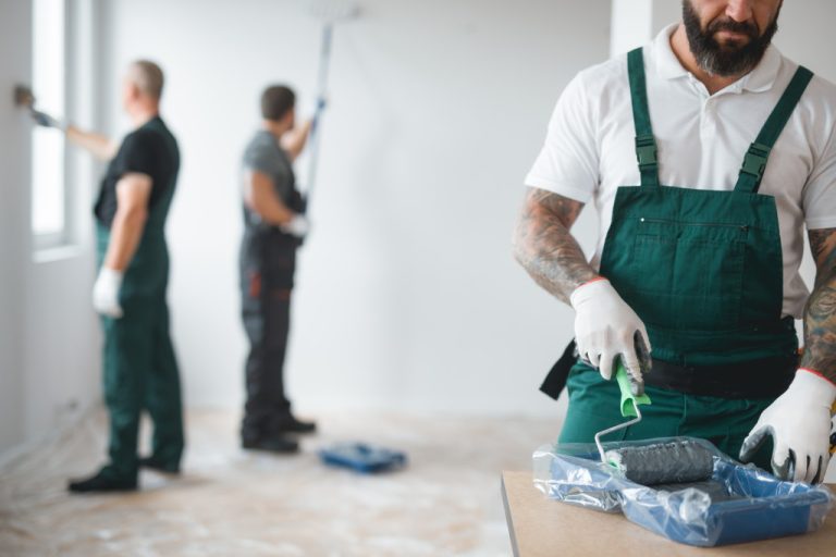 Men painting the interior of a home