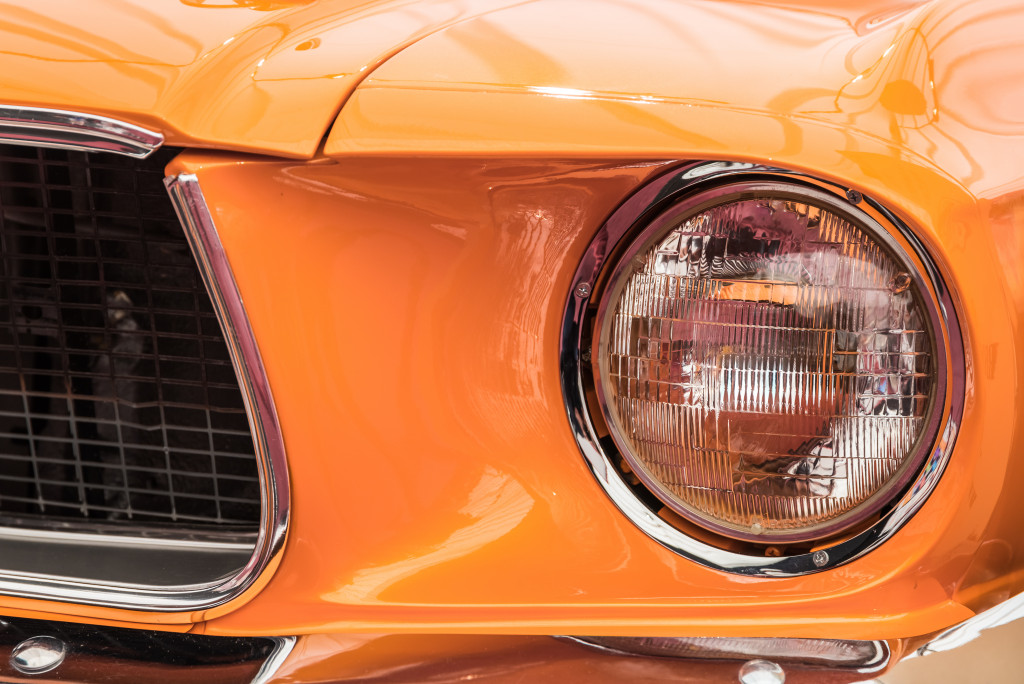 The hood of an orange classic car