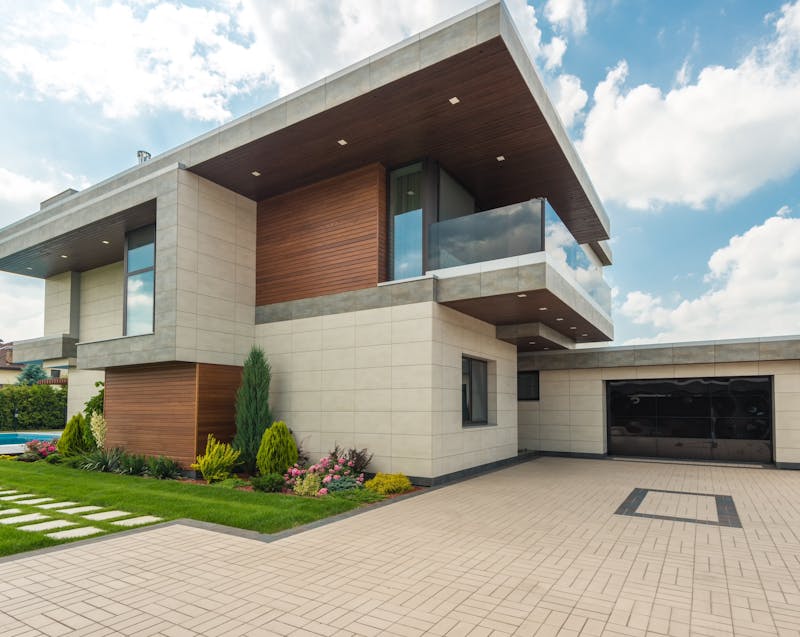 home with a swimming pool and landscaping